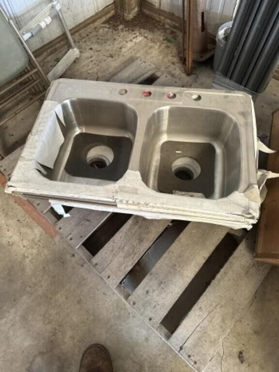 Four stainless steel double sinks