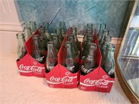 21 Empty Bottle of Coca-Cola Classic in cases. Din