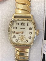 Men’s working Gruen gold watch.