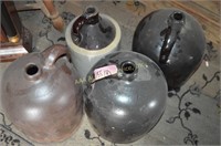 4 stoneware jugs. Height of tallest: 12 inches.