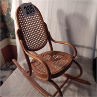 CHILD'S BENTWOOD ROCKER WITH CANE SEATING IN GOOD