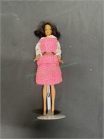 Barbie with pink knitted shirt