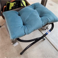 Green fold up chair with cushion