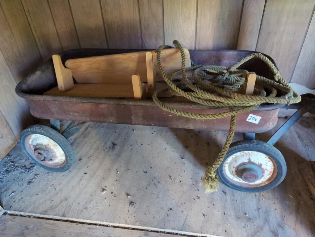 Rusted red wagon w unfinished wood projects and