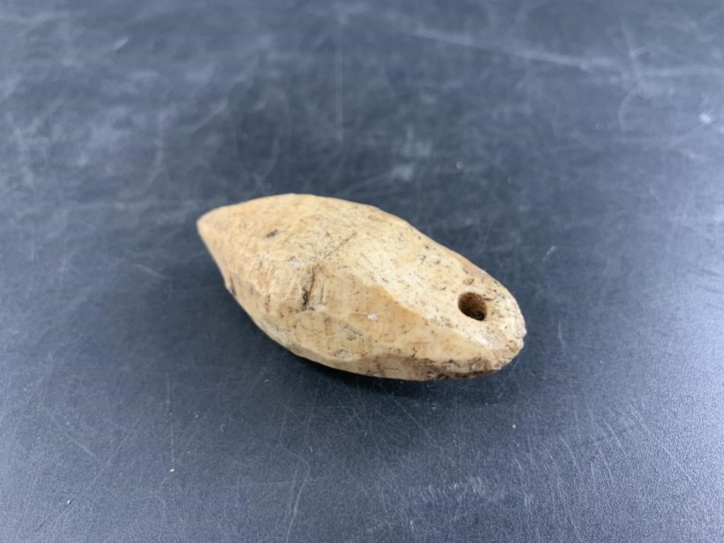 Fabulous net weight carved from walrus skull, 2 1/