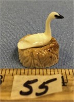 Carved ivory goose by Leonard Savage on nest with