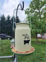 Milk can bird feeder
