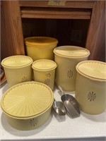 yellow Tupperware canisters