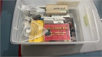 Plastic tub with contents (miscellaneous magnets)