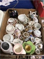 CUPS AND SAUCERS AND SMALL TEAPOTS