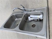 SS sink with Delta faucet