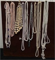 Group of pearl necklaces and a pair of earrings