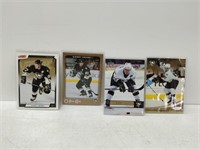 4 Sidney Crosby cards in plastic sleeves