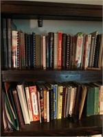 Two shelves of recipe books. Top 2 of book case