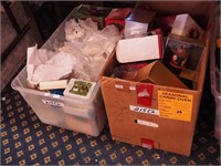 Two containers of Christmas ornaments including