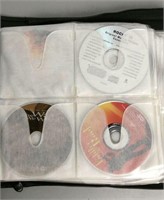 44 DVD/CD Lot With Carrying Case