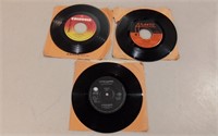 Three 7" Records Incl. Foreigner