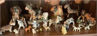 Shelf lot of puppy dog figurines, a couple horses