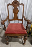 Vintage carved mahogany cushioned arm chair.