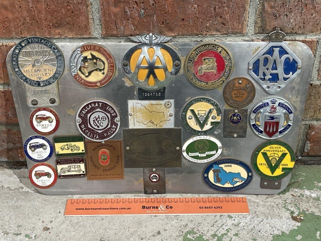 Display Board With Mounted Car Badges Inc. Rally,