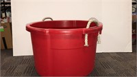 Circular red storage bin with rope handle