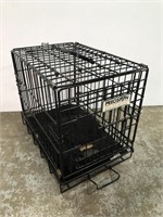 Small metal dog kennel with cushion
