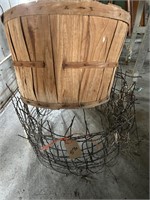 Wire fence and bushel basket