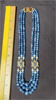 Blue beaded necklace.