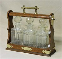 English Oak Tantalus with Cut Crystal Decanters.