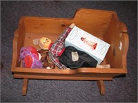 Wooden cradle with misc dolls