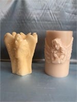 2- LARGE ANGEL CANDLES. 1 IS WAX THE OTHER LED