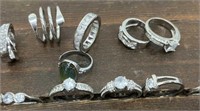 16 pretty rings – not sterling. Various sizes,