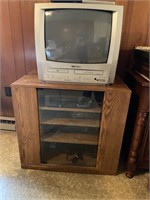 Glass fronted cabinet w/ TV & VCR Player