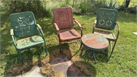 Three metal outdoor chairs, and one metal outdoor