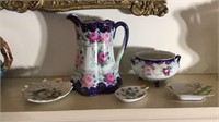 5 pieces of floral painted china, matching water