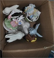 box of rabbit figurines