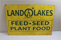 Yellow metal Land O Lakes feed sign