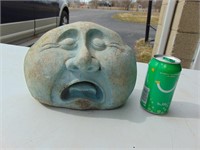 sad rock face