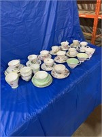 Large quantity of cups and saucers, some