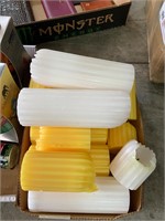 box lot of yellow and white candles