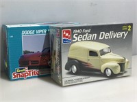 ERTL and SnapTite model cars in box. One sealed,