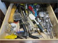 drawer of kitchen utensils flatware assorted
