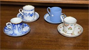 Four Danbury Mint Cup and Saucer Sets