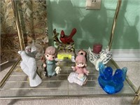 Buds & angel figurines on bottom shelf