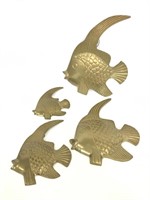 Four brass fish wall art