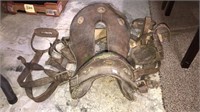 Antique horse saddle with straps and stirrups,