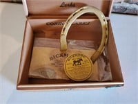 Cigar box, horseshoe, salve