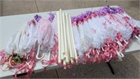 16 lace parasols with 14 plastic sleeves.