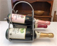 Metal wine rack w/ sparkling juice bottles (3)