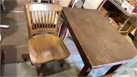 Small oak wood desk with an antique oak desk chair